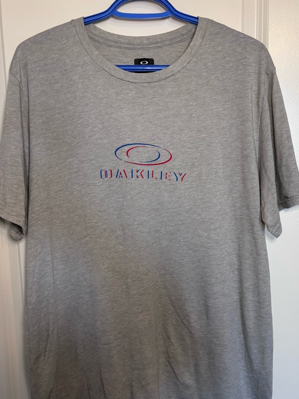 Oakley Light Gray Short Sleeve Logo Tee with Blue & Red Accents